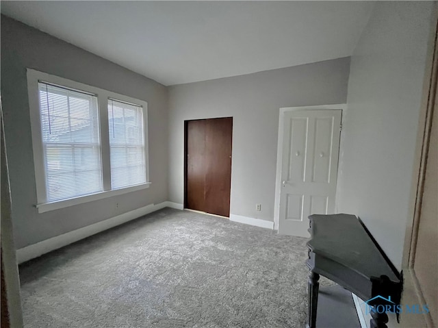 unfurnished bedroom with carpet