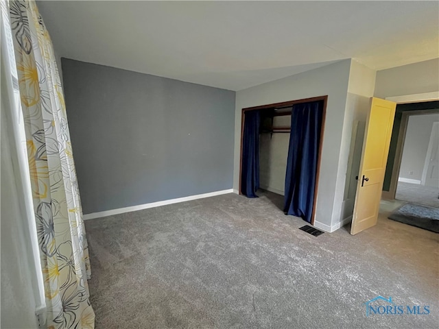 unfurnished bedroom featuring carpet flooring