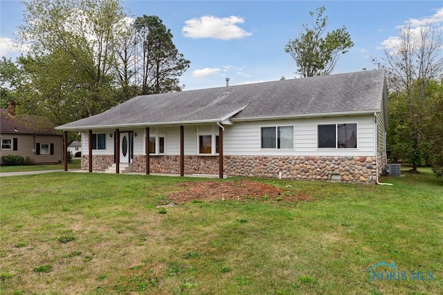 ranch-style home with a front yard and central air condition unit