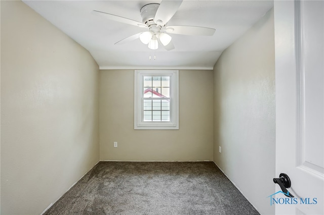 unfurnished room with carpet, vaulted ceiling, and ceiling fan