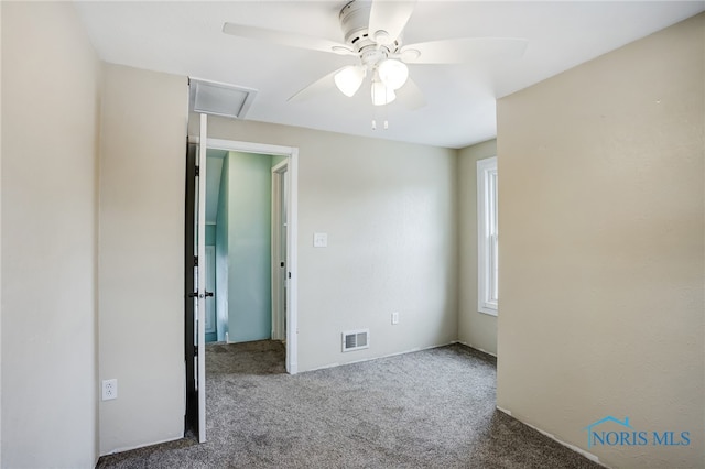 empty room featuring ceiling fan and carpet flooring