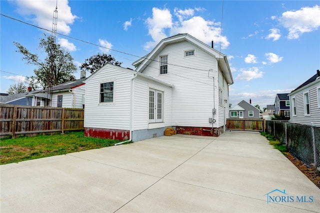 back of house with a patio area