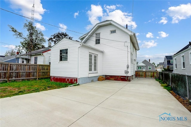 2915 N 109th St, Toledo, OH 43611 - back of property featuring crawl space, a fenced backyard, and a patio