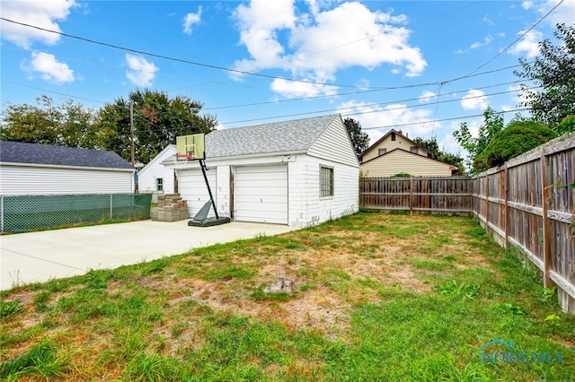 garage featuring a yard