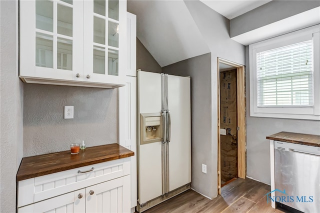 kitchen with white cabinets, white fridge with ice dispenser, light wood-type flooring, and dishwasher