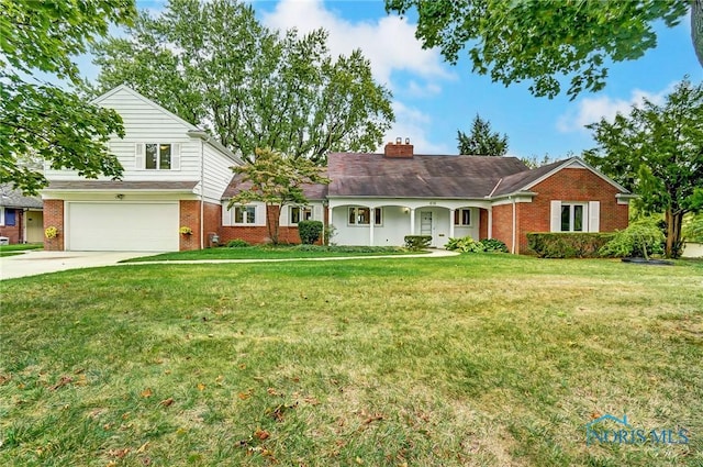 view of front of house featuring a garage and a front yard