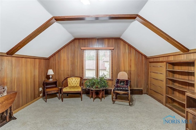 living area with light carpet and vaulted ceiling