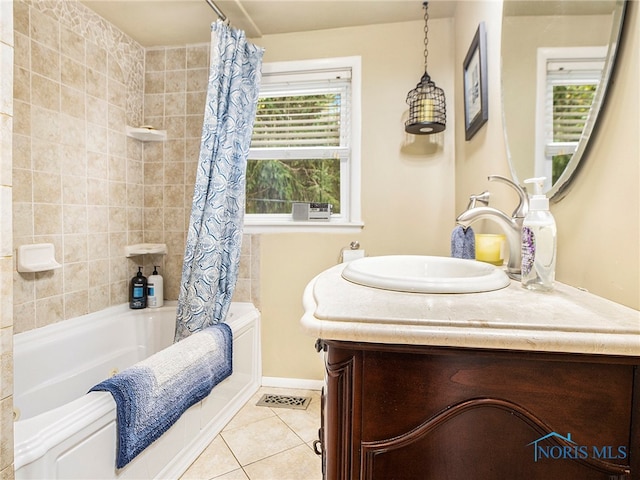 bathroom with shower / bathtub combination with curtain, tile patterned flooring, and vanity