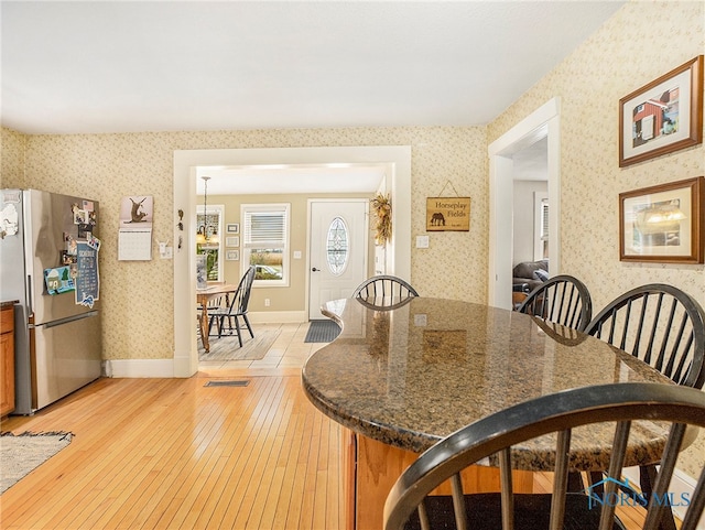 dining area with light hardwood / wood-style flooring