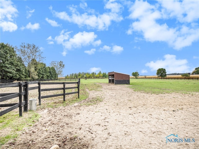 exterior space with an outbuilding and a rural view