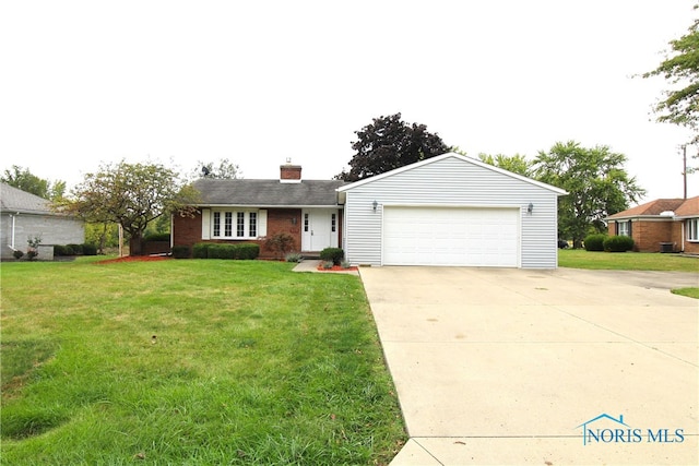 ranch-style house featuring a garage and a front lawn