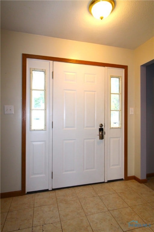 tiled entryway featuring a wealth of natural light