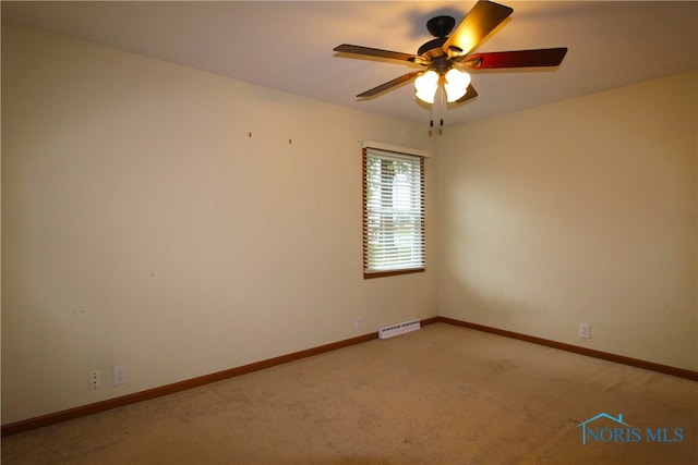 carpeted empty room with ceiling fan