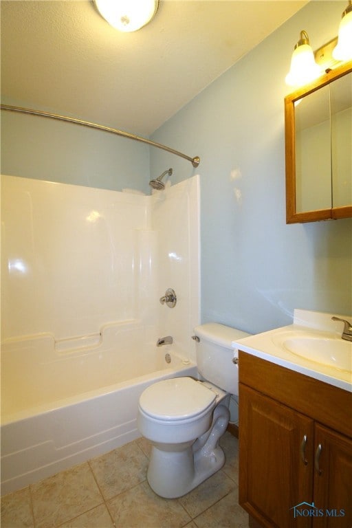 full bathroom with shower / tub combination, tile patterned floors, toilet, and vanity