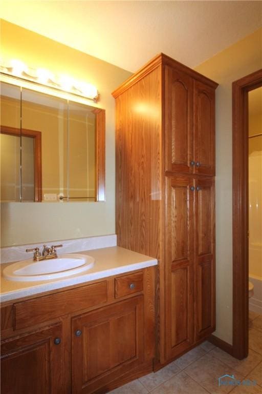 bathroom with vanity and tile patterned floors