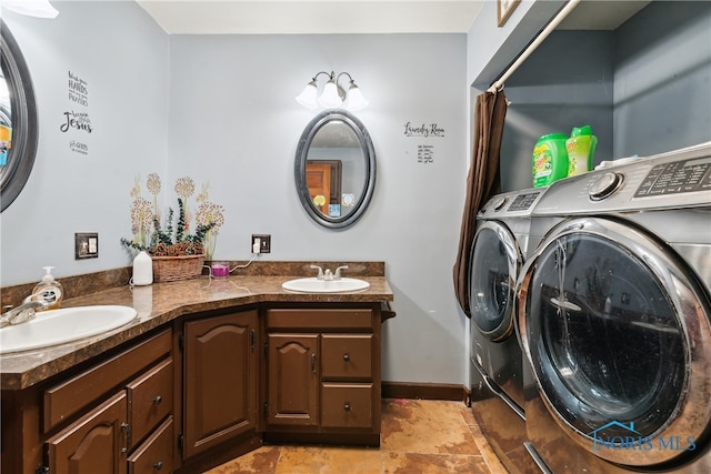 bathroom with vanity and washing machine and dryer