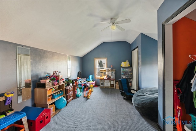 game room with carpet floors, ceiling fan, and vaulted ceiling