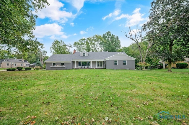 view of front of home with a front yard