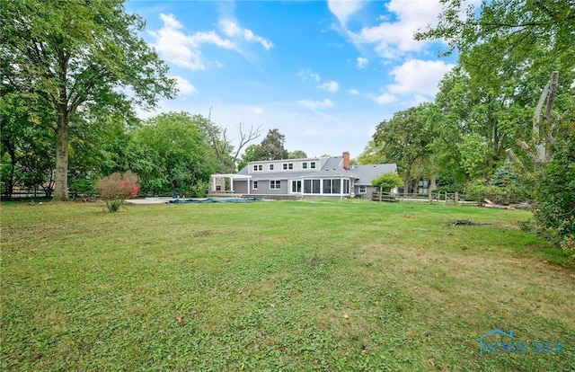 view of yard with a pool