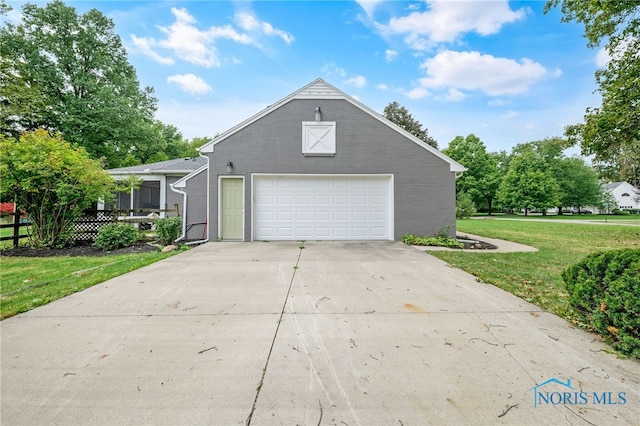 view of property exterior featuring a lawn and a garage