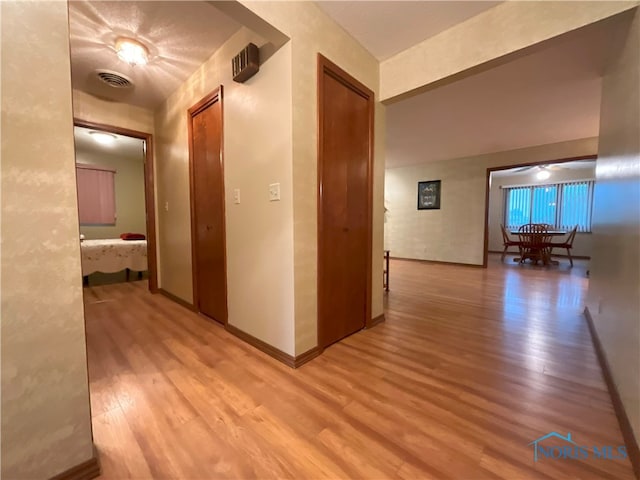 hallway featuring light wood-type flooring