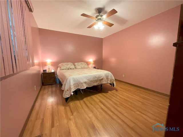 bedroom featuring ceiling fan and light hardwood / wood-style flooring