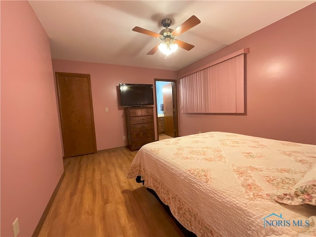 bedroom featuring light hardwood / wood-style floors and ceiling fan