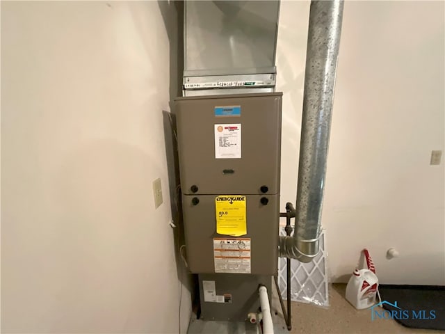 utility room with heating unit