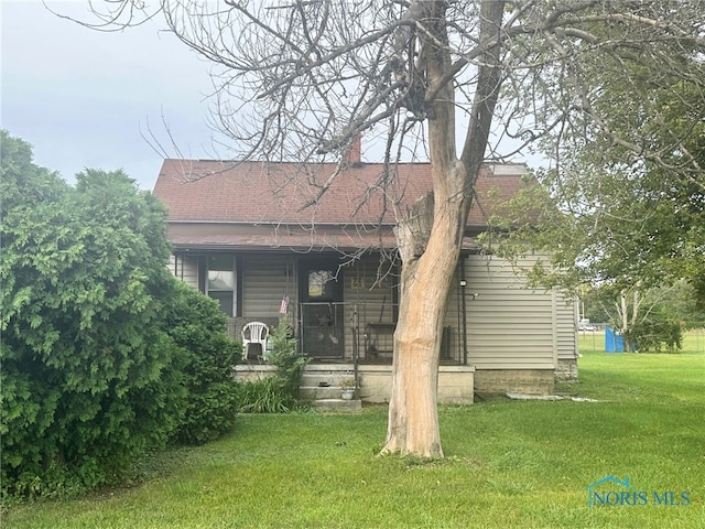 view of property exterior featuring a lawn