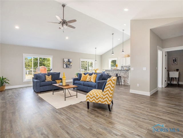 living room with high vaulted ceiling, wood-type flooring, and ceiling fan