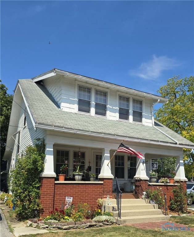 view of front of property featuring covered porch