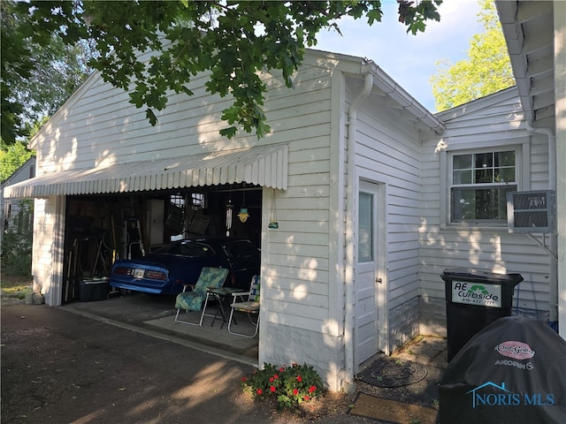 view of property exterior featuring a garage