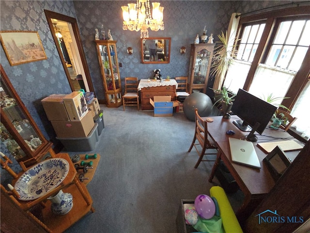 dining room featuring carpet flooring and a chandelier