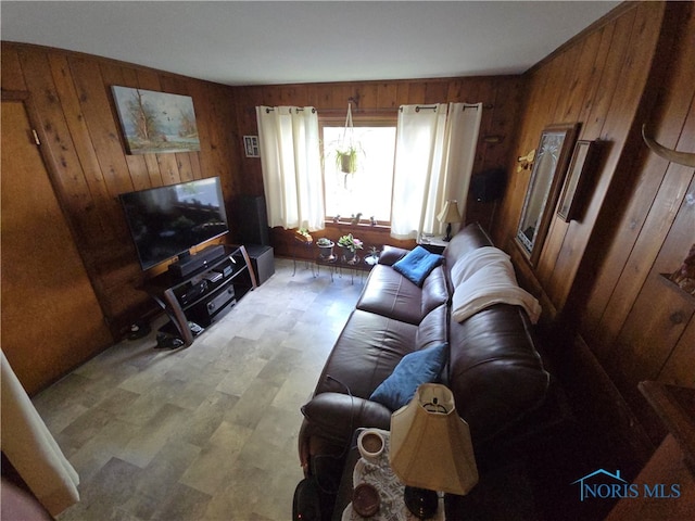 living room with wood walls