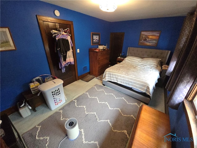 carpeted bedroom featuring a closet