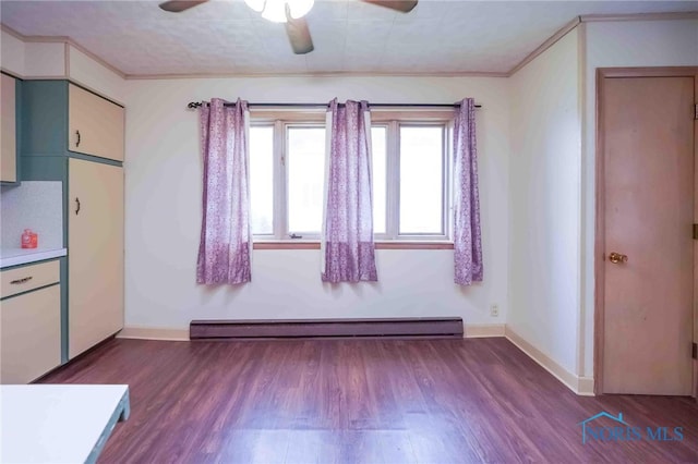 kitchen featuring light wood-type flooring, ornamental molding, baseboard heating, and ceiling fan