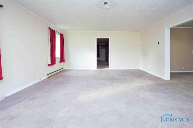 empty room featuring a baseboard heating unit