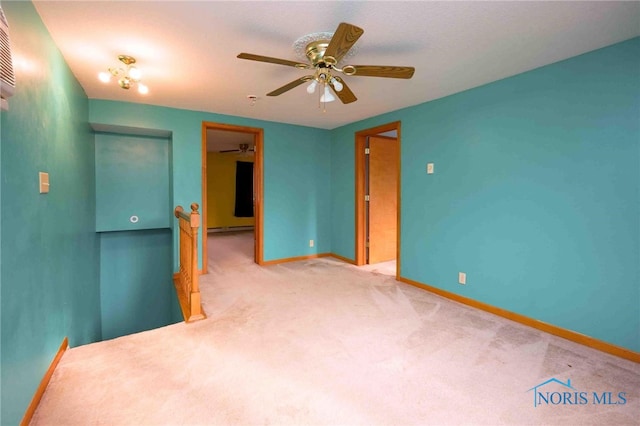 unfurnished room featuring ceiling fan and carpet floors