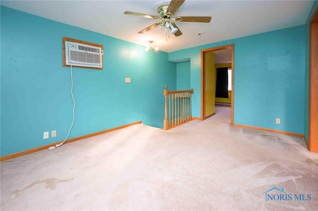 spare room featuring ceiling fan and light colored carpet