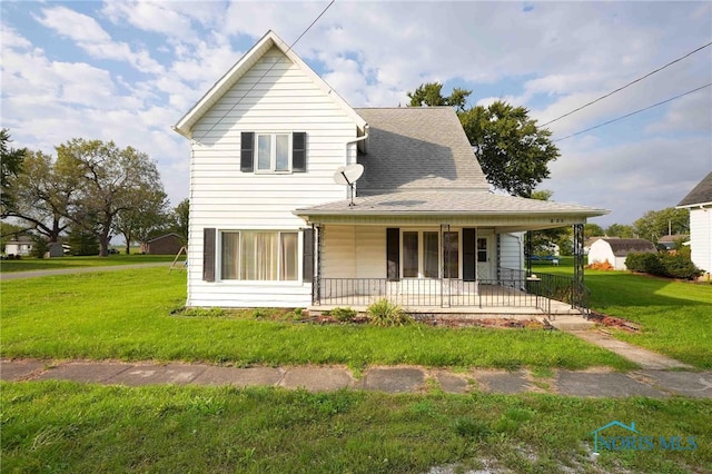 view of front of house featuring a front lawn and covered porch