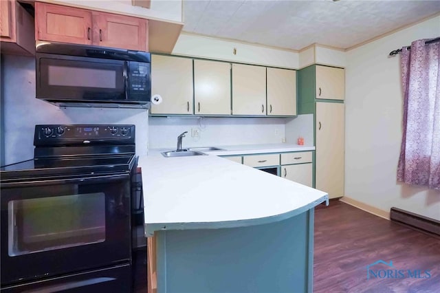 kitchen featuring dark hardwood / wood-style flooring, black appliances, kitchen peninsula, and sink