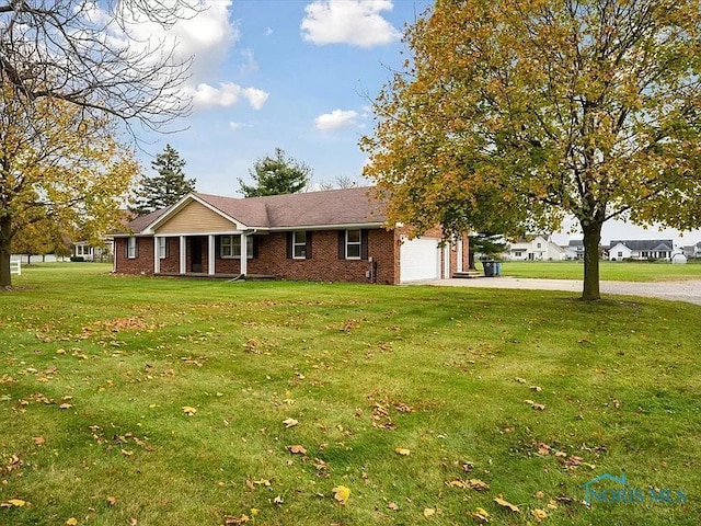 view of front facade with a garage and a front lawn