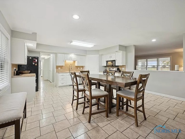 dining room featuring sink