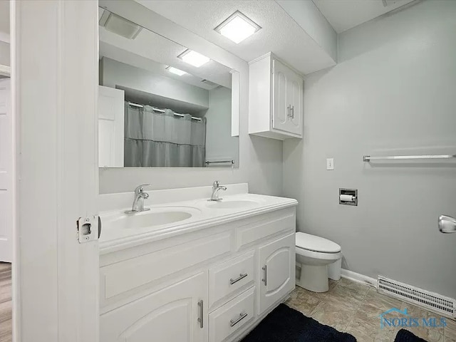 bathroom featuring vanity, toilet, and a shower with curtain