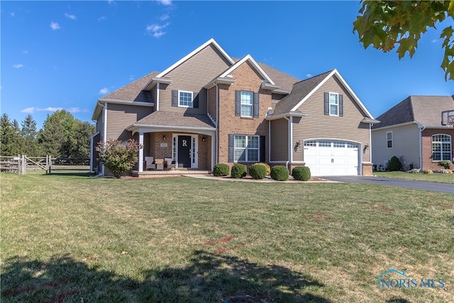 view of front facade featuring a garage and a front lawn