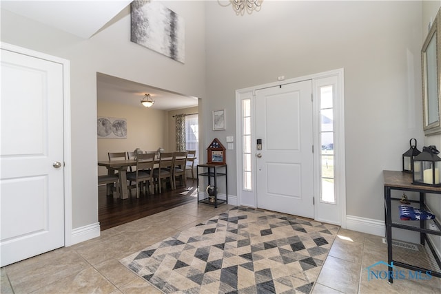 foyer entrance with light tile patterned floors