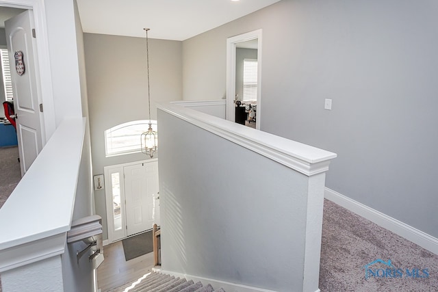 stairway featuring hardwood / wood-style flooring