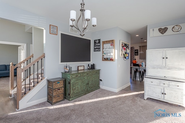 interior space with a chandelier and light carpet