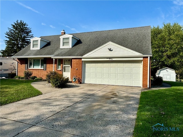 view of front of property featuring a garage and a front yard