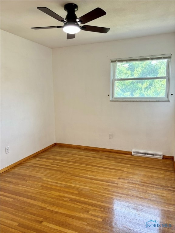 unfurnished room featuring ceiling fan and light hardwood / wood-style flooring